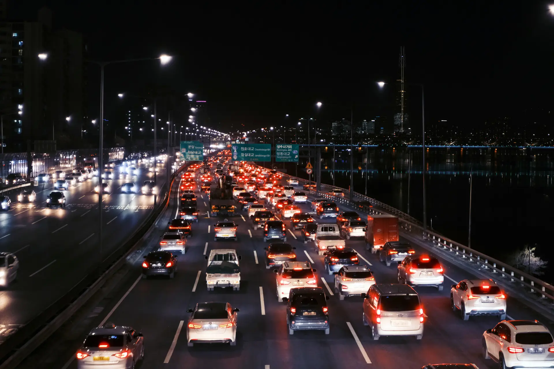 Night, Traffic Congestion in Korean Highway. Many cars are stuck at the middle of highway