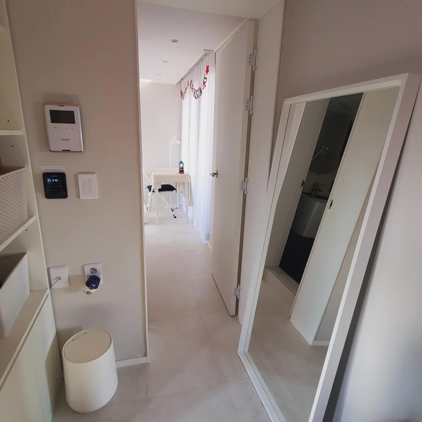 Entryway with a full-length mirror and a smart-home control panel (Listing ID : 6307)