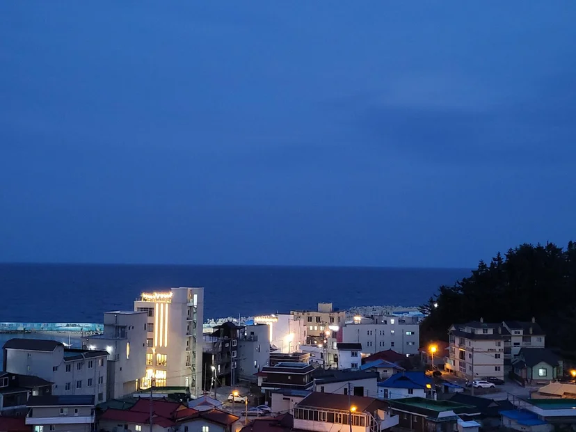 Night view of the coastal town and sea from the balcony (Listing ID : 3535)