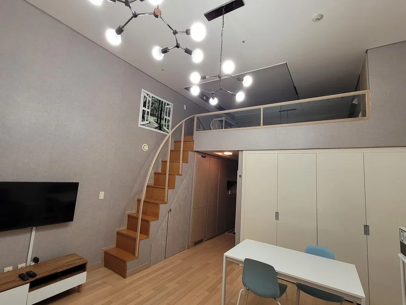 Loft dining and living area with staircase and pendant lights (Listing ID : 3984)