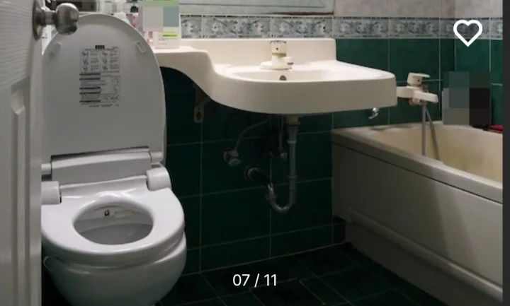 Tiled bathroom with a bathtub and a bidet toilet (Listing ID : 11420)