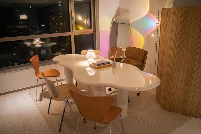 Designer dining table and chairs beside floor-to-ceiling windows (Listing ID : 11396)