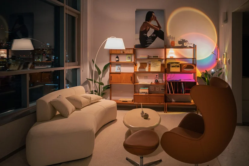 Designer living room with a curved sofa and night city view (Listing ID : 11396)