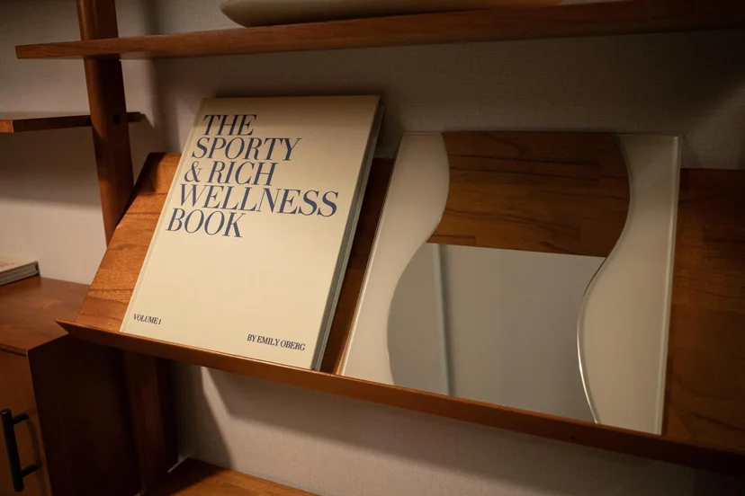 Shelf styling with a design book and a wavy accent mirror (Listing ID : 11396)