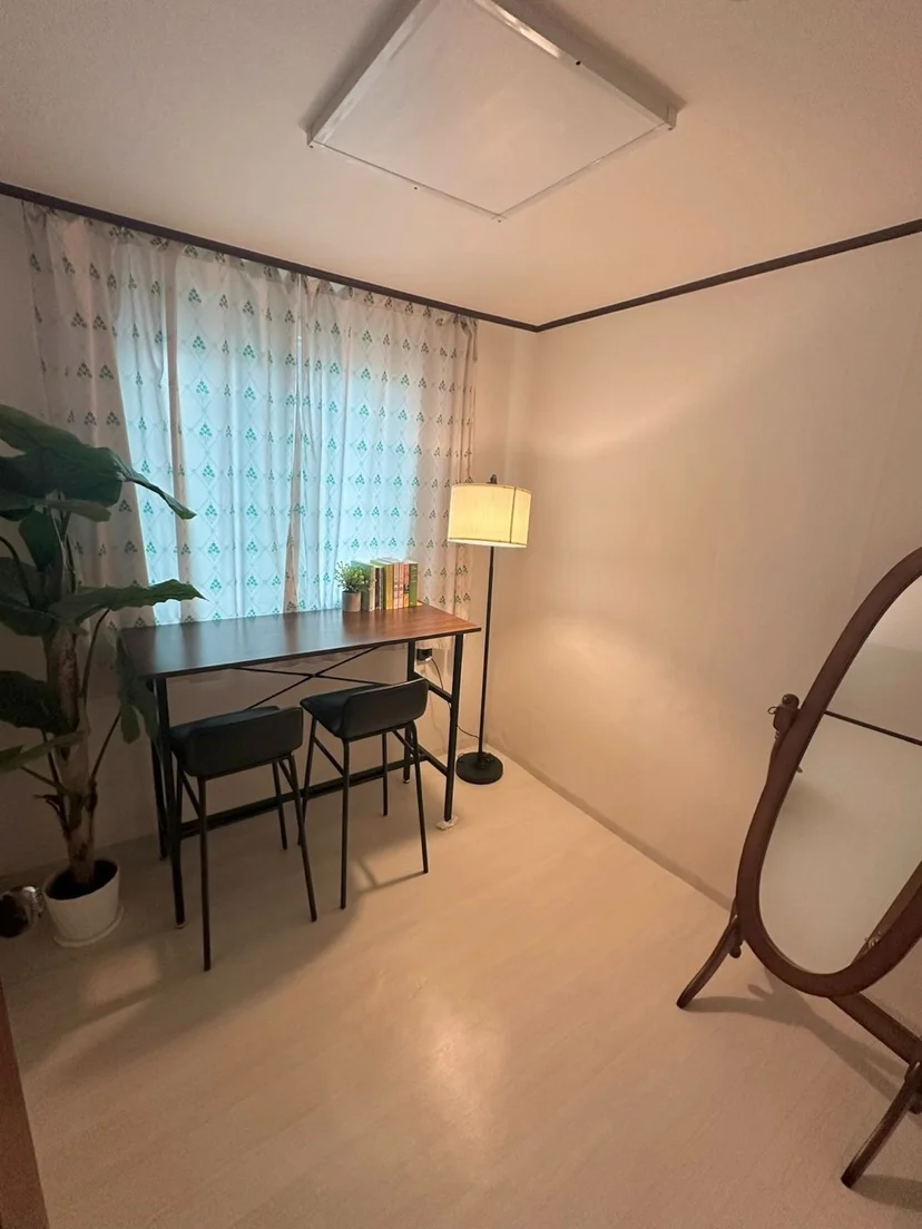 Study room with a desk for two, floor lamp and plant (Listing ID : 25342)