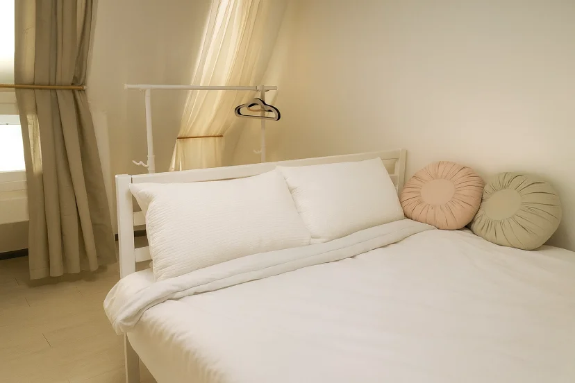 Bedroom with a double bed and sheer curtains (House no. : 36619)