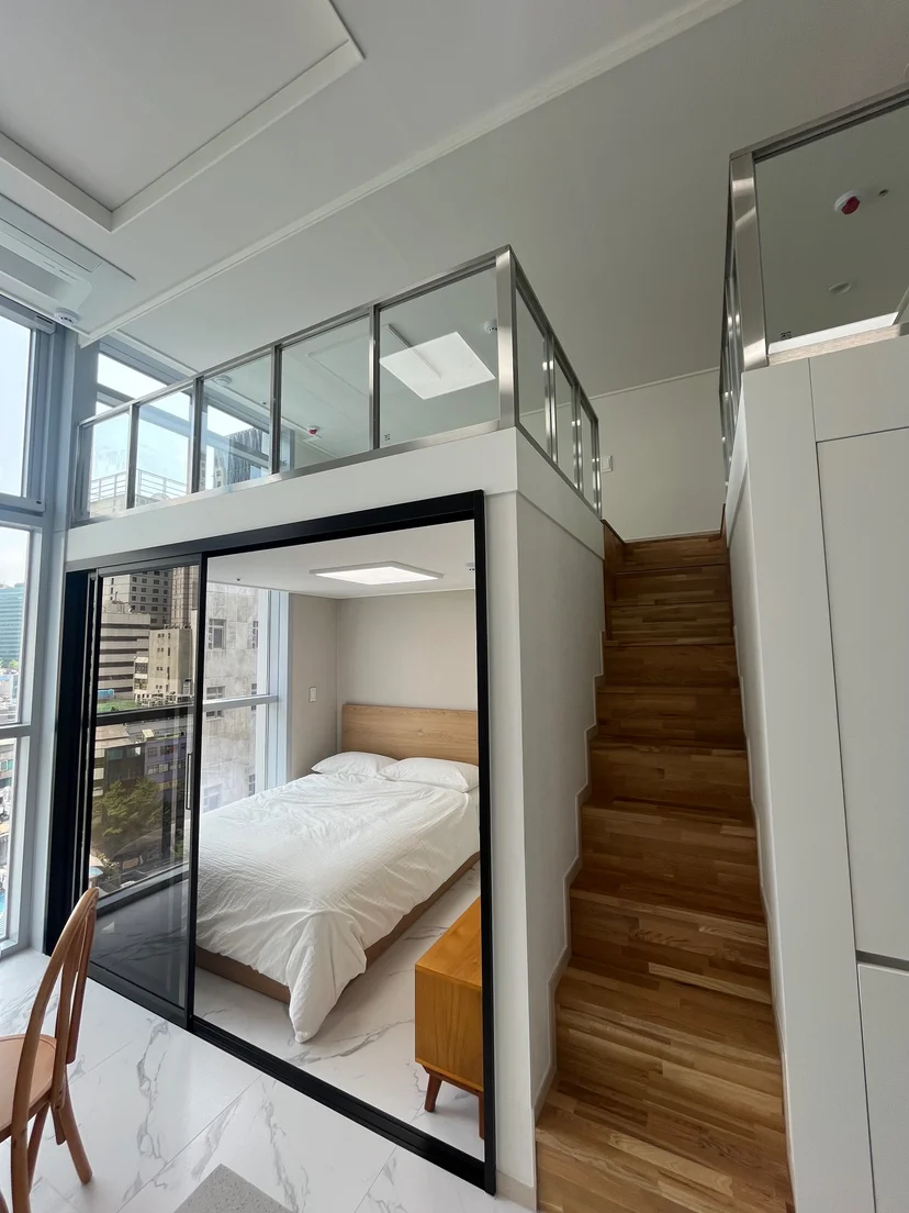 Loft stairway over the glass-enclosed bedroom nook (Listing ID : 42899)