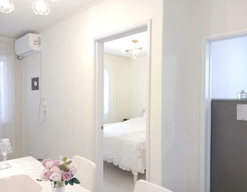 View from the dining table through a doorway into the white bedroom (Listing ID : 29514)