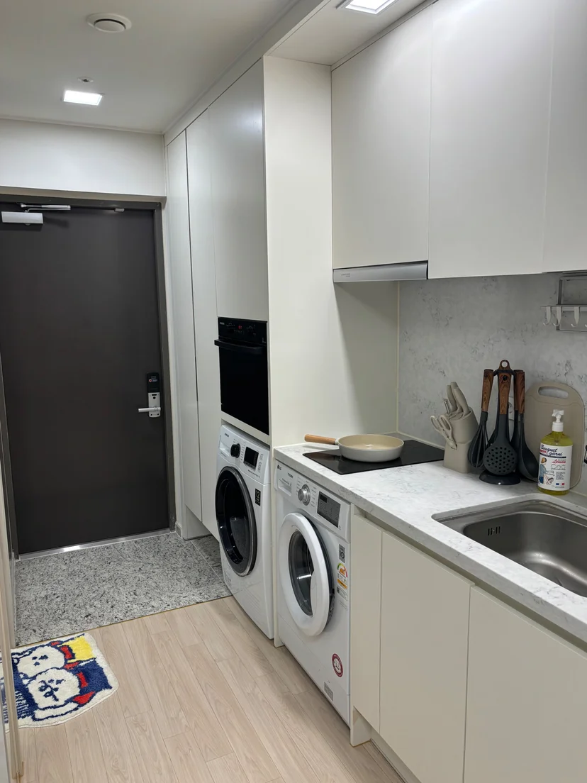 Studio interior with a wall-mounted TV and hardwood floor (Listing ID : 43231)