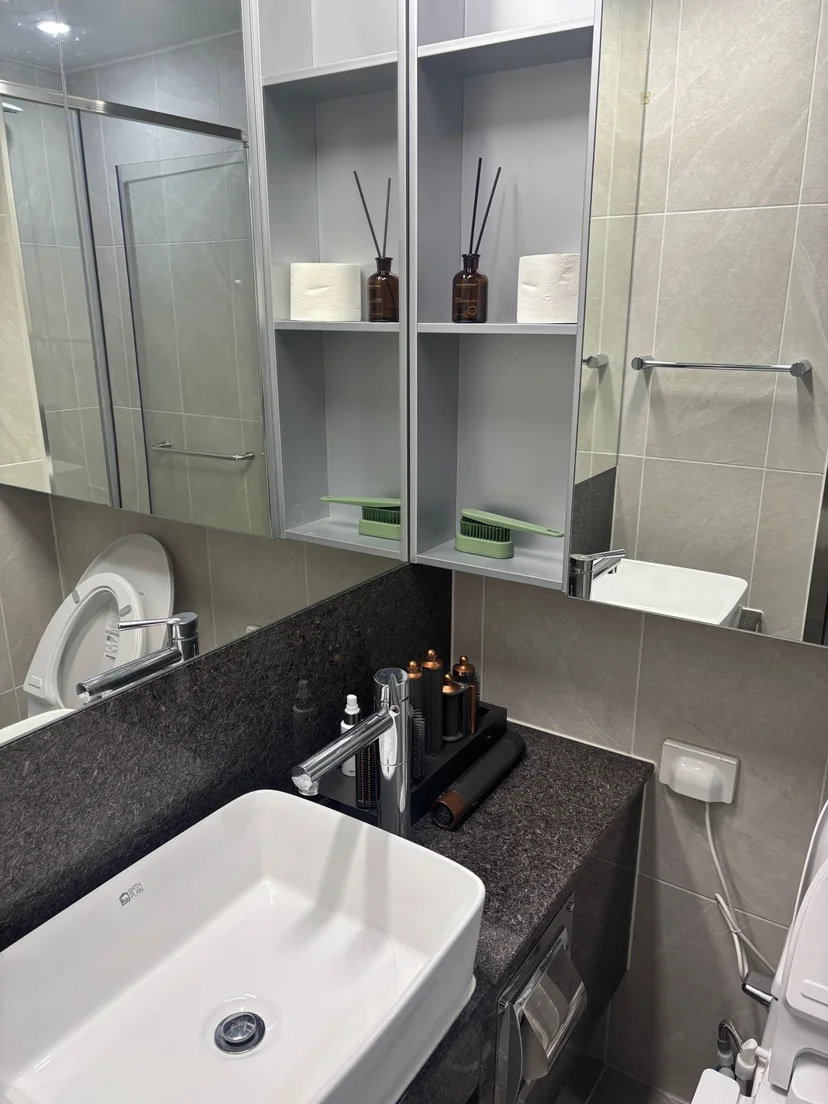 Studio living corner with a wall-mounted TV and seating (Listing ID : 43231)