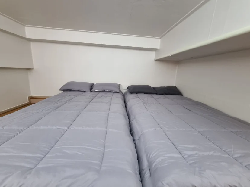 Two single beds with gray bedding on the loft level (Listing ID : 44519)