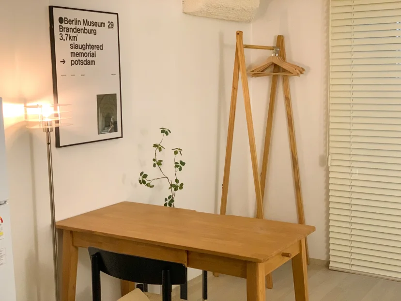 Wooden desk, chair, clothes rack and floor lamp in the room (Listing ID : 46336)
