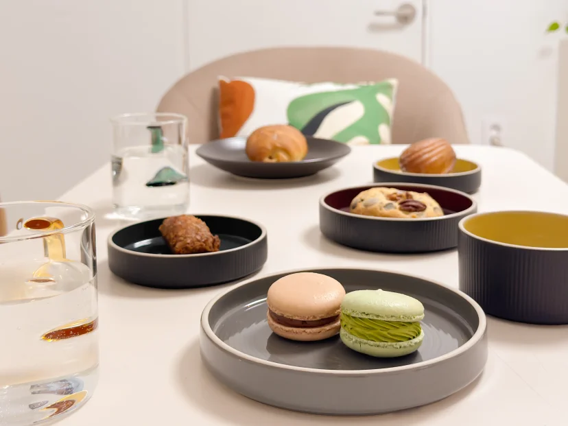 Pastries and macarons plated on the dining table (Listing ID : 47877)