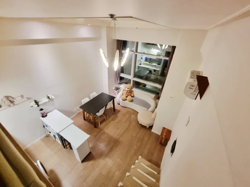 Open loft studio with pendant lights and a city-view window (Listing ID : 44519)