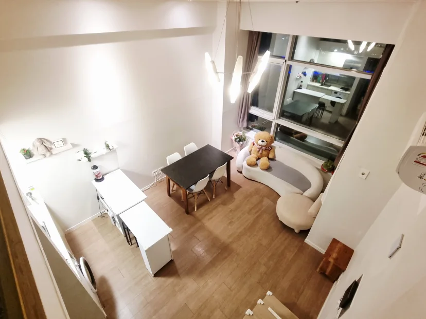 Lower floor with dining table, sofa and desk under tall windows (Listing ID : 44519)