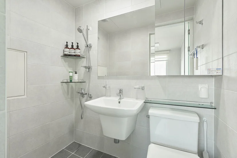 Light gray bathroom with wall-mounted sink and shower (Listing ID : 32541)