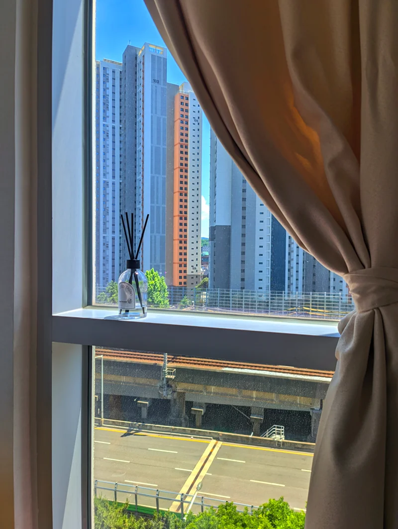 Window sill with a daytime view of nearby high-rises (Listing ID : 23498)