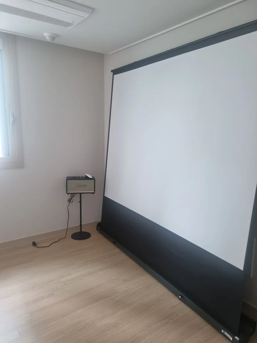 Third room set up as a home theatre with a projector screen (Listing ID : 26688)