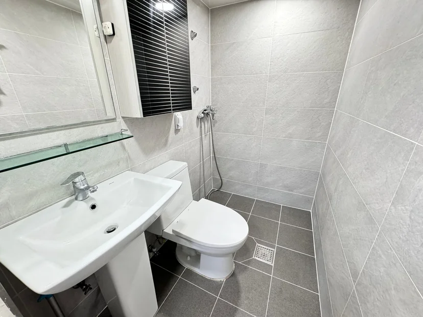 Modern grey-tiled bathroom with a sink and shower area (Listing ID : 26009)