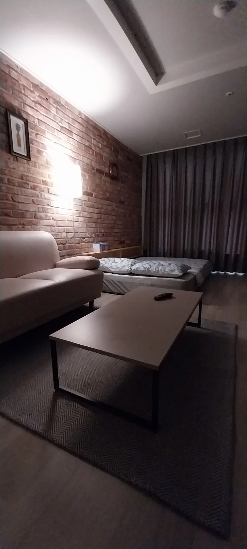 Living area at night with a large sofa and warm lighting (Listing ID : 14737)