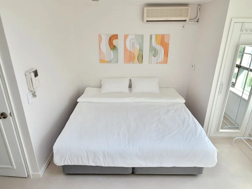 Beds pushed together into a super king under artwork (Listing ID : 29409)