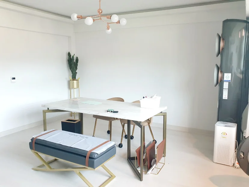 Marble dining table with beige chairs, pendant light, tower AC in bright interior (Listing ID : 24807)