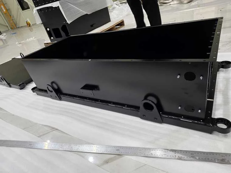 Black powder-coated battery enclosure with mounting brackets manufactured by Belinker