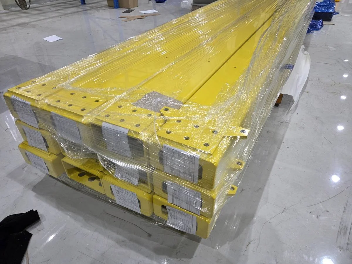 Shrink-wrapped painted steel components palletized for export shipping to USA