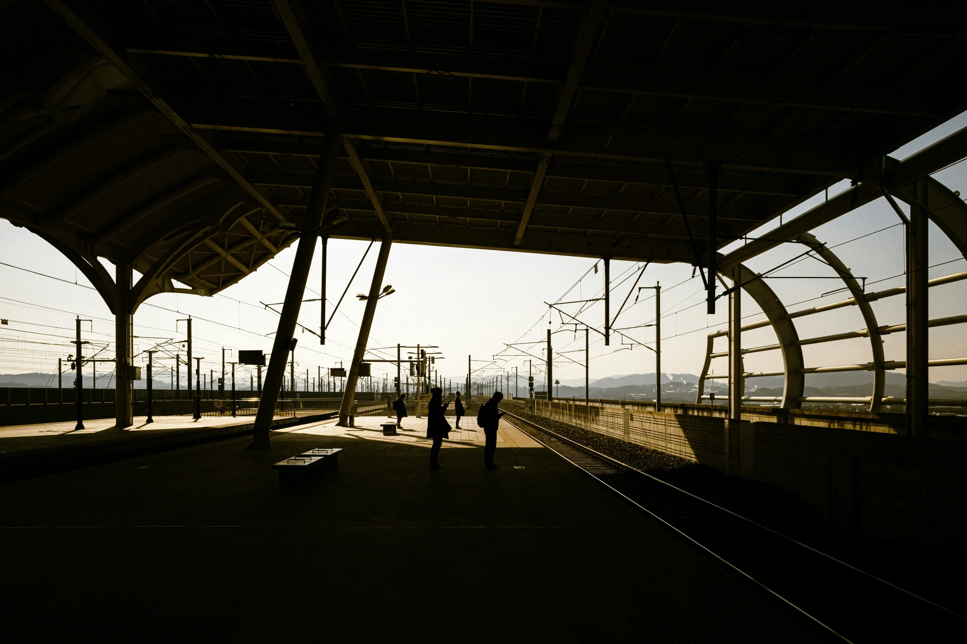 Passengers waiting at a train station platform in South Korea