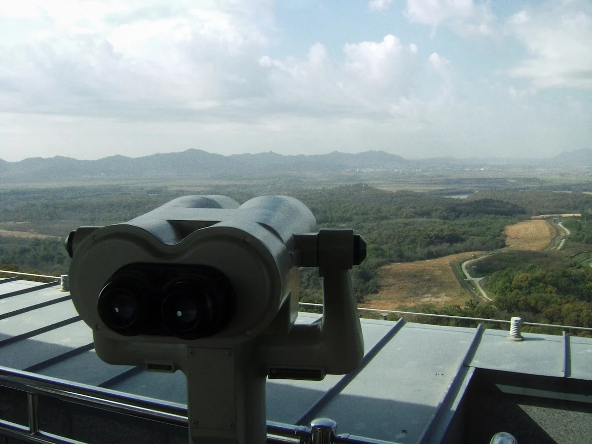 Telescope binoculars at Dora Observatory overlooking the DMZ valley toward North Korea
