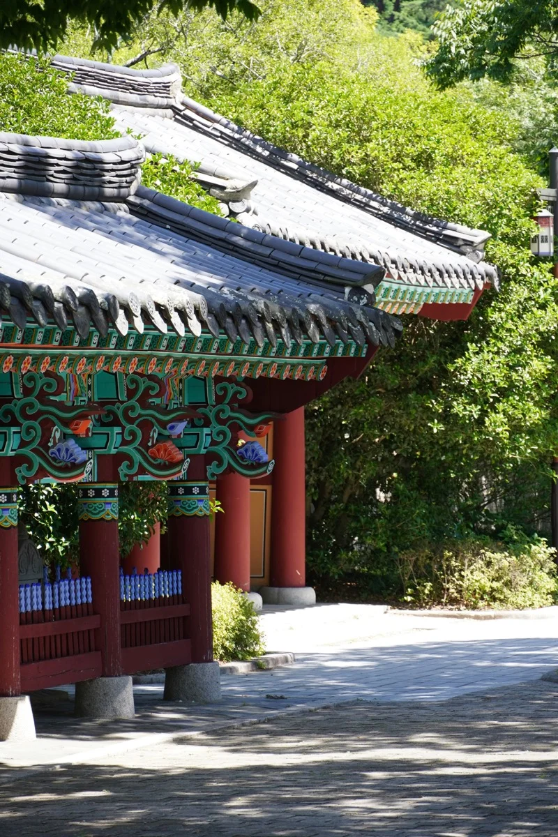 Traditional Korean Buddhist temple with vibrant colorful details and ornate roof architecture