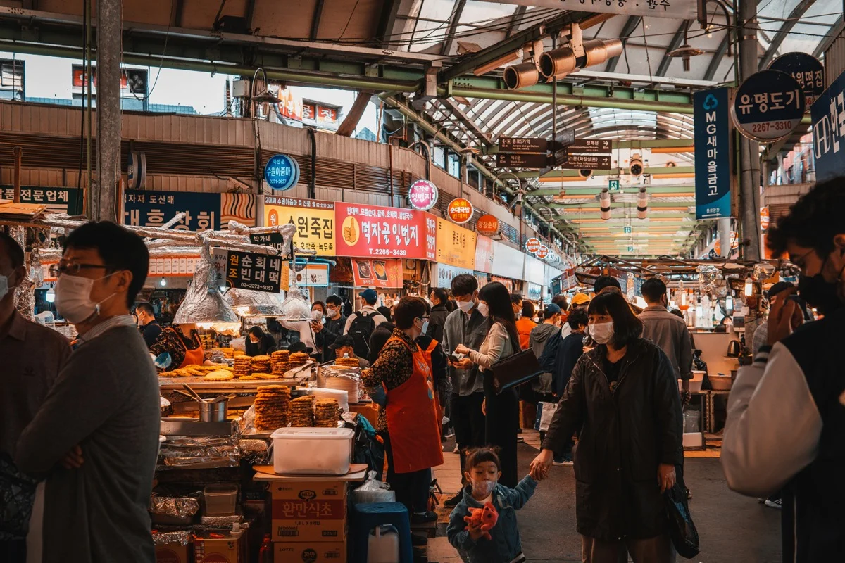 Korean street food vendors at a bustling market near Gwangalli, Busan