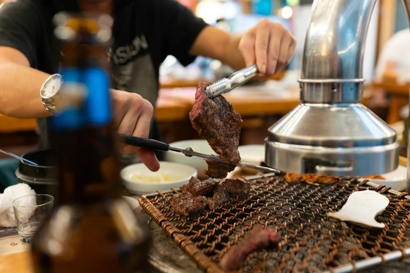 Korean BBQ restaurant dining scene in Seomyeon with banchan side dishes