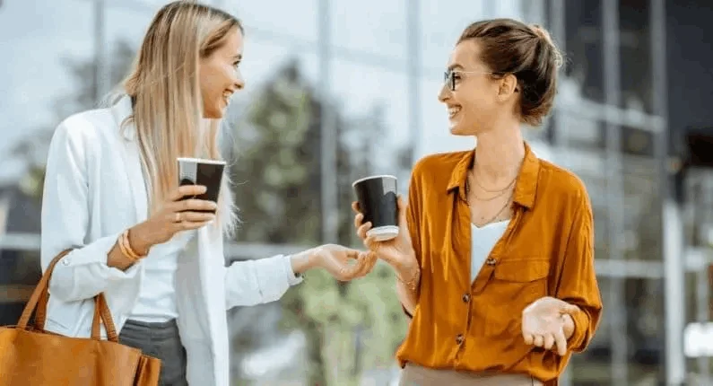 people are smiling with their coffee