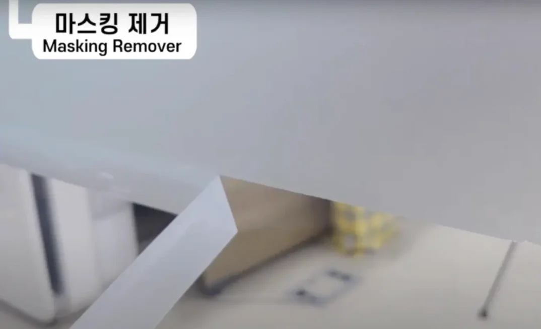 Remove the masking before the paint dries.