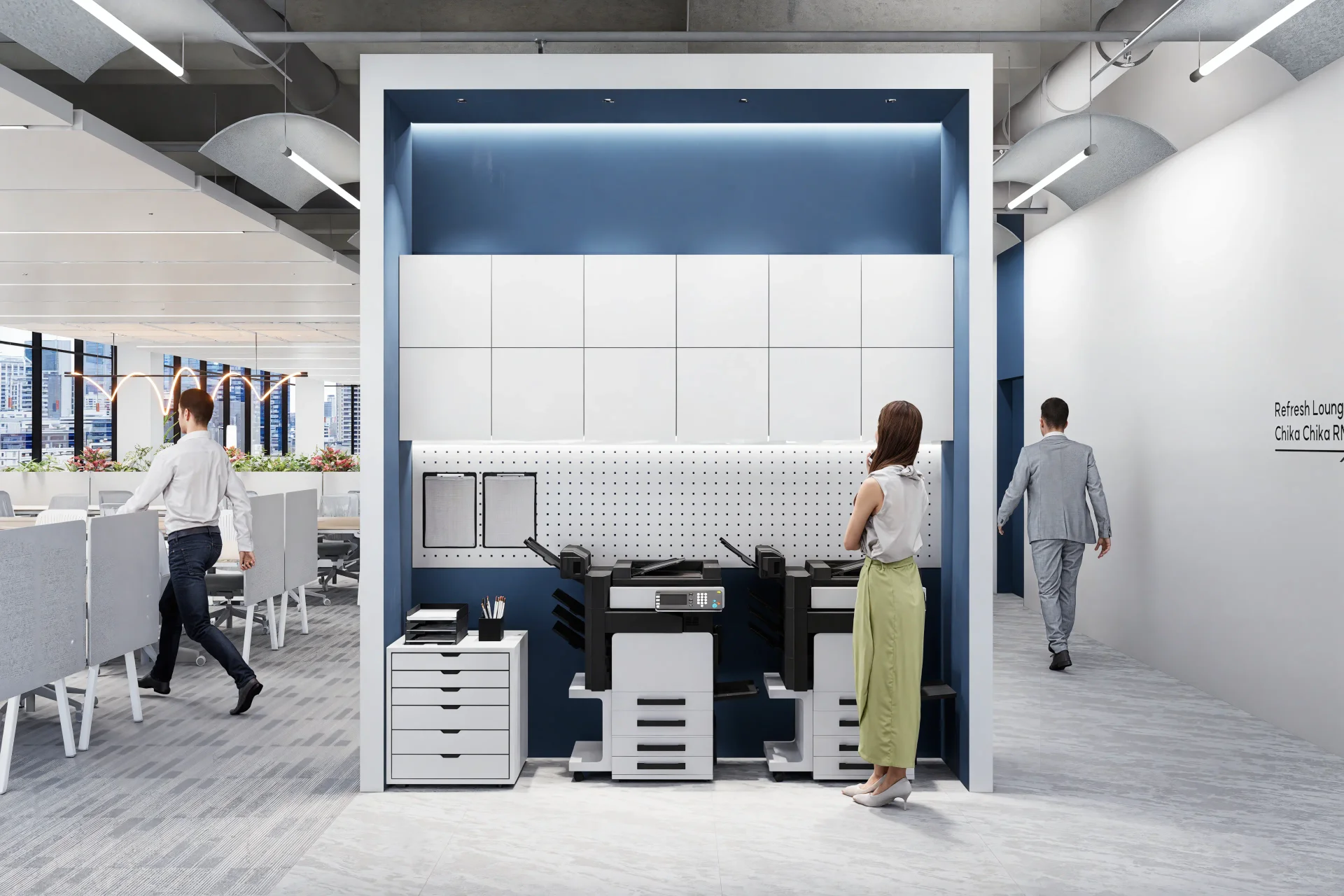 BUILDUS가 디자인한 기능적인 프린트 스테이션으로, 효율적인 문서 작업을 위한 공간입니다. 푸른색 배경과 흰색 수납장이 조화를 이루며, 한 사람이 장비를 사용하고 있습니다. 복사기, 프린터, 정리함이 통합된 이 공간은 직원들이 업무 중 필요한 문서 작업을 한 곳에서 편리하게 처리할 수 있도록 설계되었습니다.