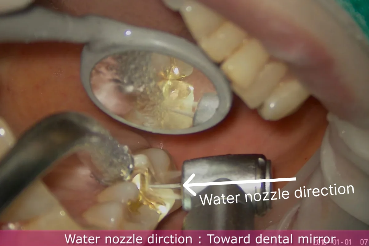 Water nozzle directed to mirror
