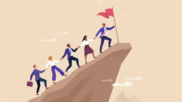 Leader guiding team up mountain toward success flag