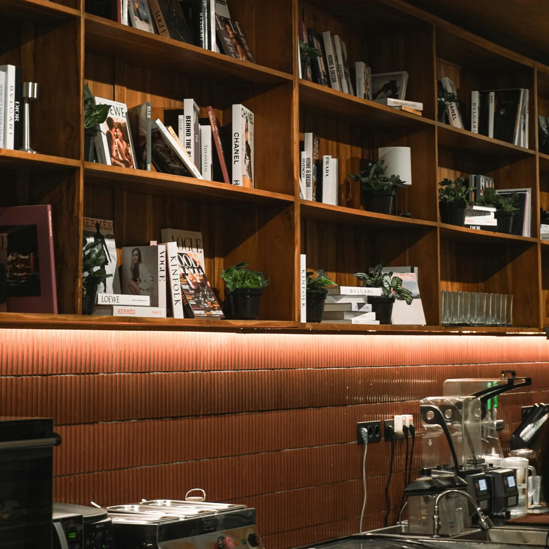 A cafe with books on the walls