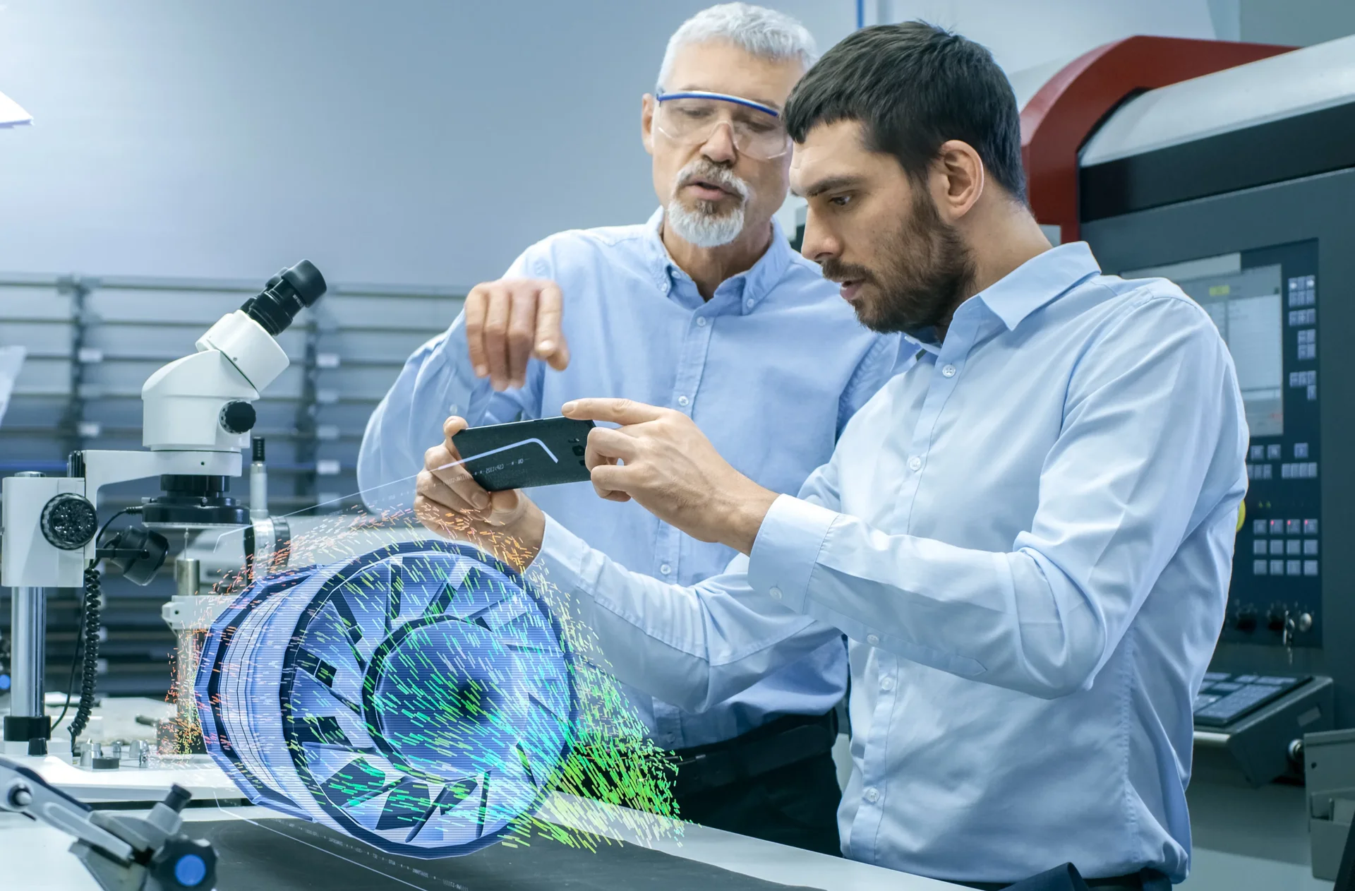 엔지니어들이 디지털 트윈 기술로 가상 터빈을 시각화하며 증강현실 기기를 통해 설계 데이터를 분석하는 모습