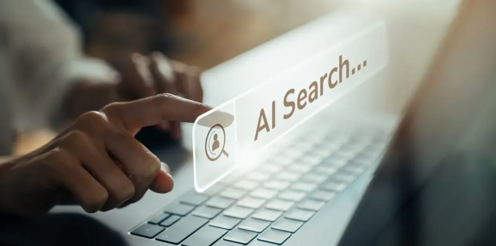 Finger pressing virtual "AI Search" button on laptop keyboard, symbolizing artificial intelligence in search technology.