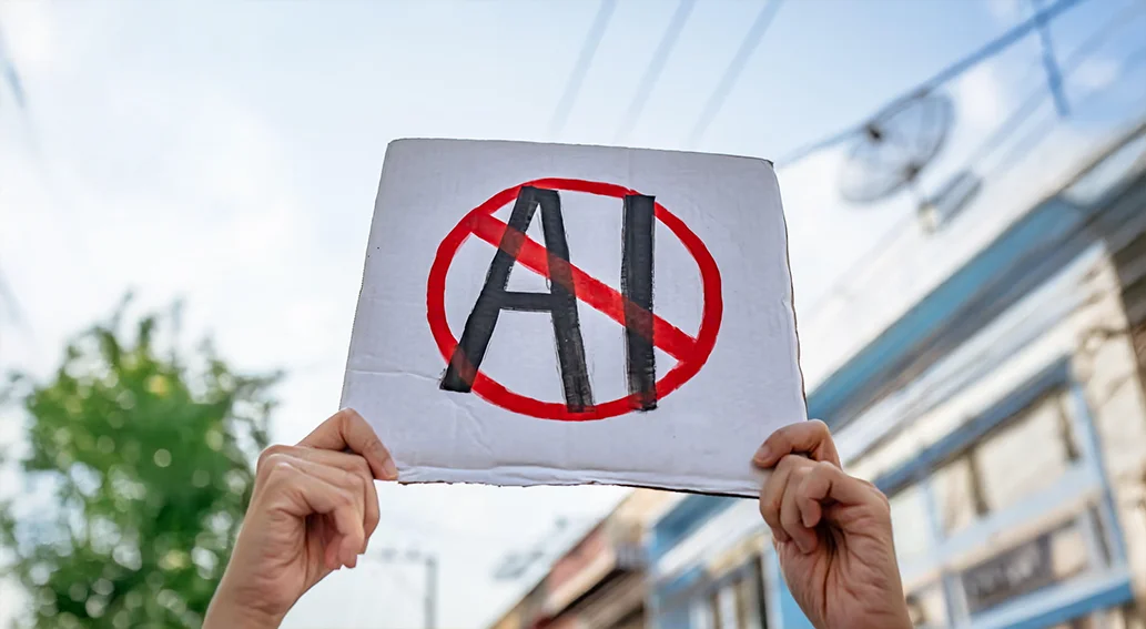 AI 반대 피켓을 들고 있는 시위 현장