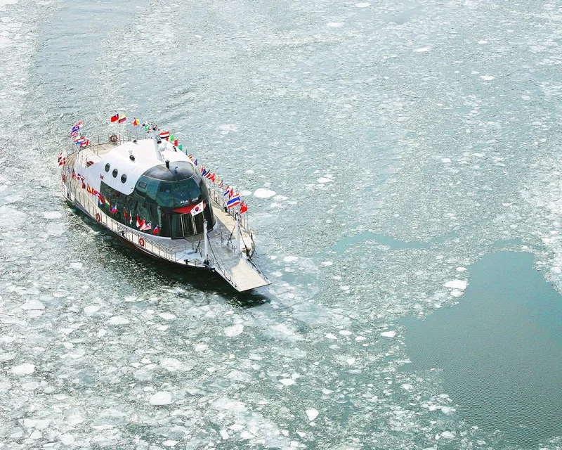 Nami Island's Ice Breaker Boat is going across the frozen Bukhan river