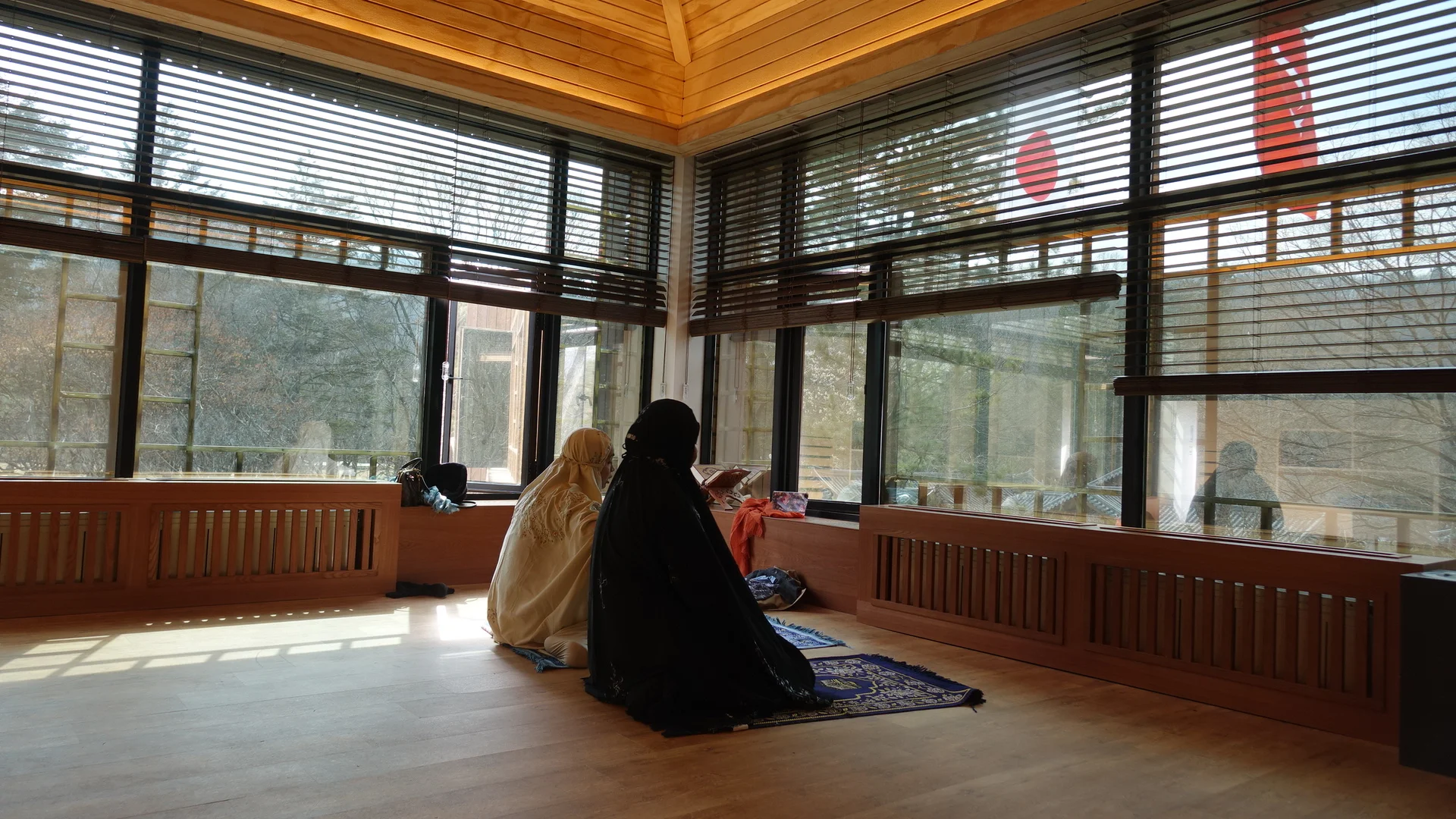 Prayers room inside Nami Island, two Muslim woman are praying insde the paryers room