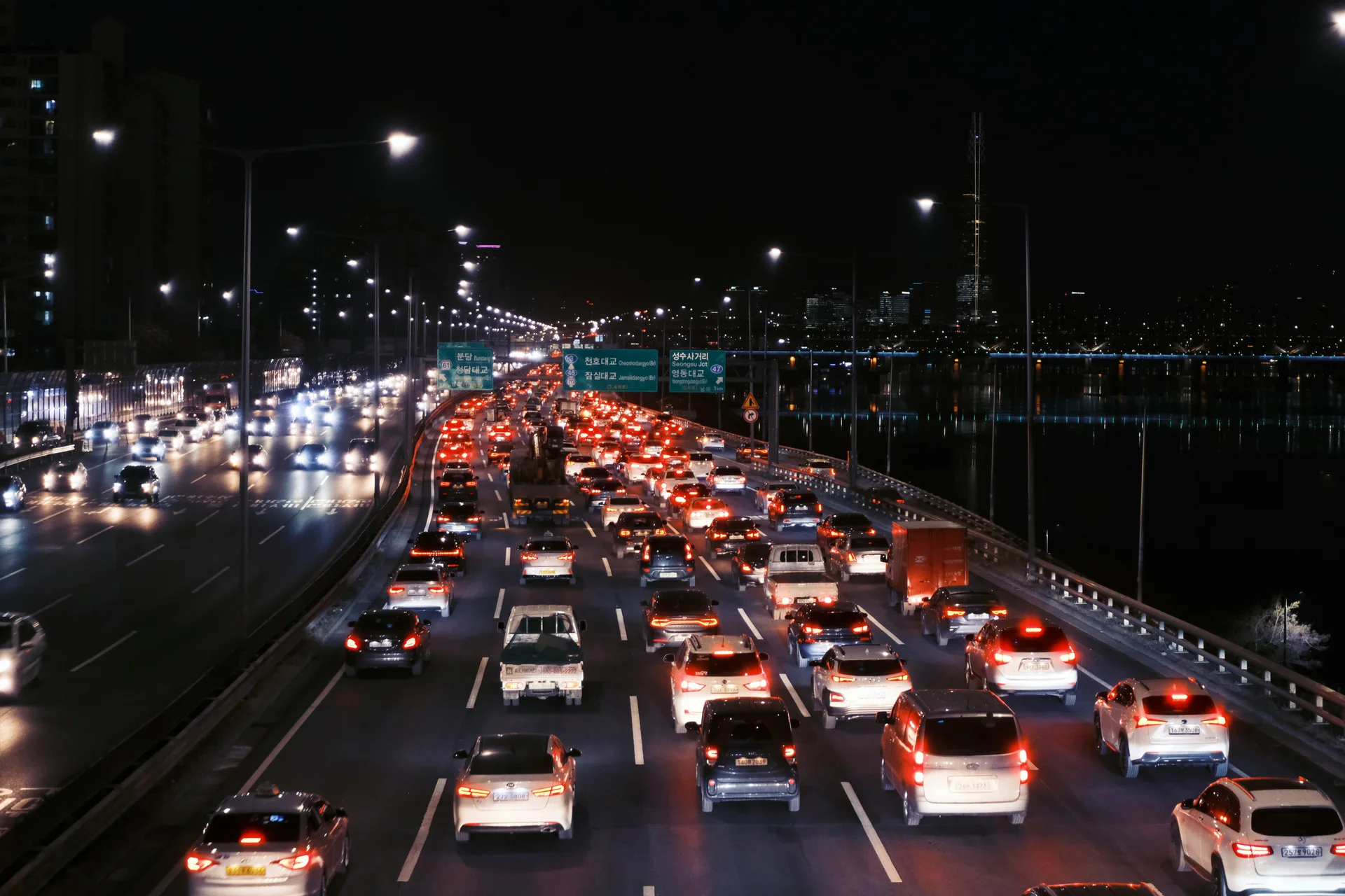 Night, Traffic Congestion in Korean Highway. Many cars are stuck at the middle of highway