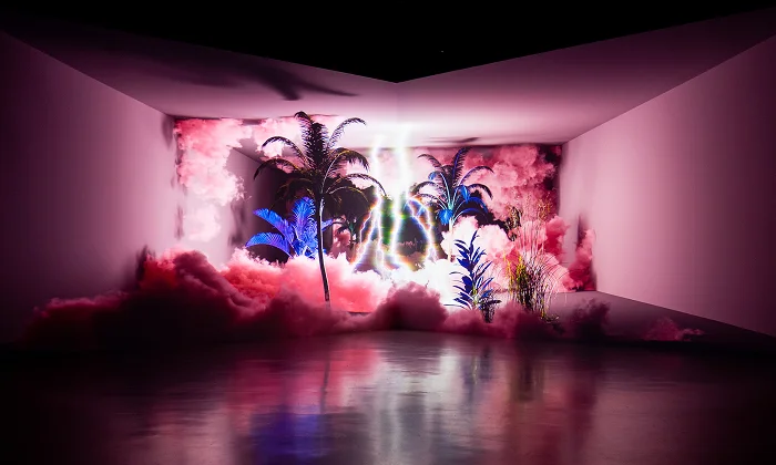 Immersive digital art installation with neon palm trees and pink clouds at Arte Museum Jeju, South Korea — a top indoor attraction for Muslim-friendly family travel.