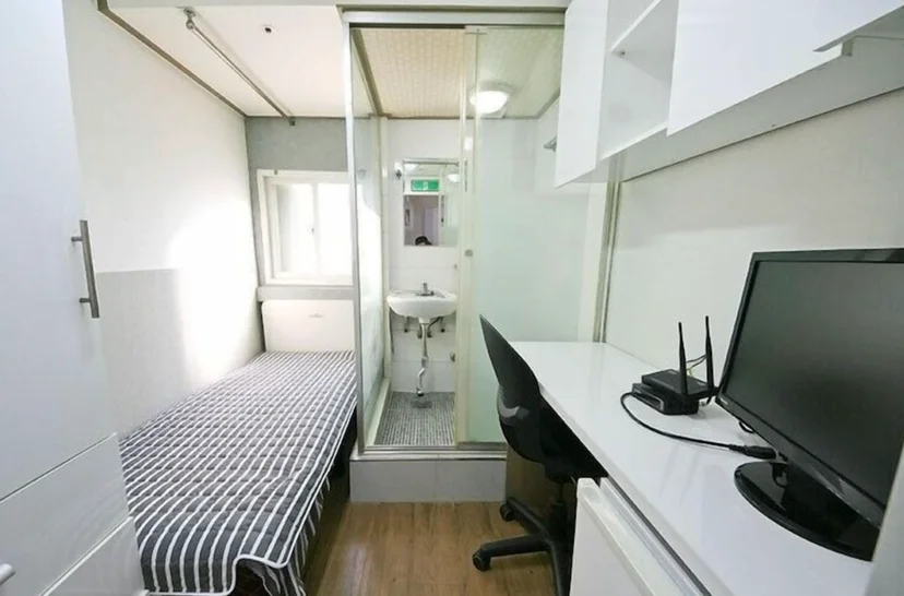 Modernized Goshiwon interior with updated furniture and clean design.