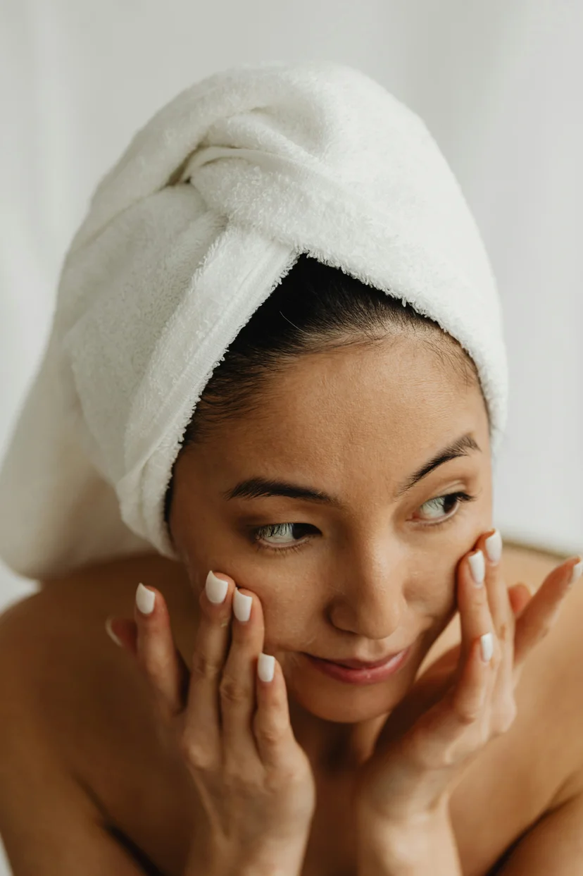 woman with applying Pdrn skincare products 