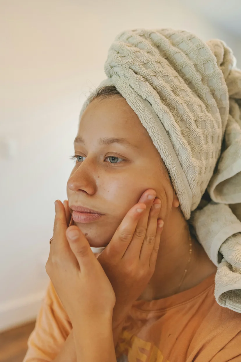 a girl who cares her skin barrier watching herself
