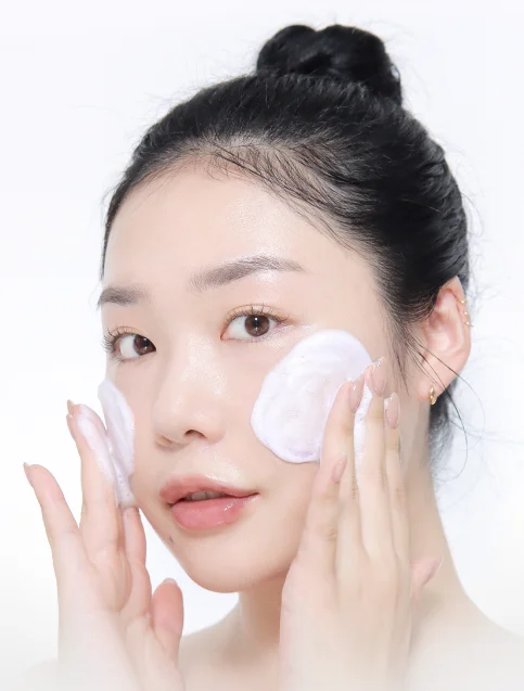 woman who washing face with gentle cleanser